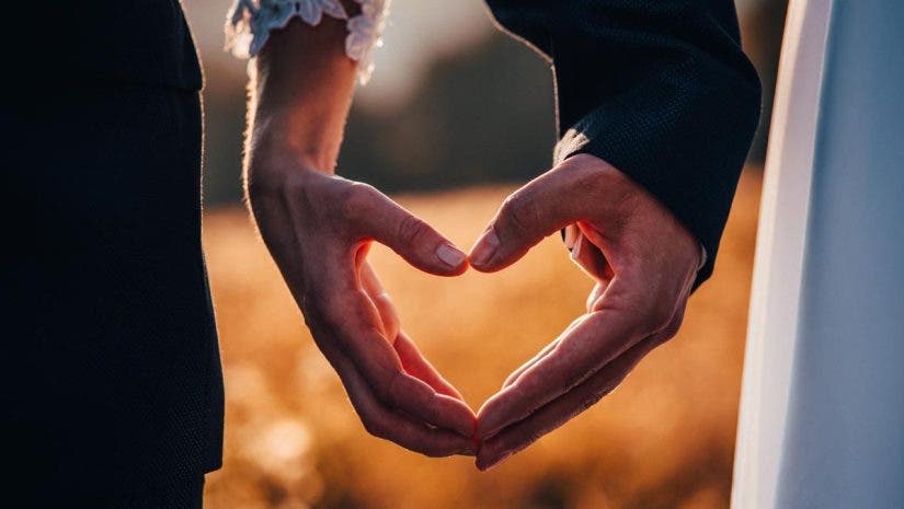 Hands of man and woman in shape of heart, wedding, valentine, love photo