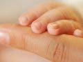 Baby and mother hands together - great idea for Mother's Day, Macro