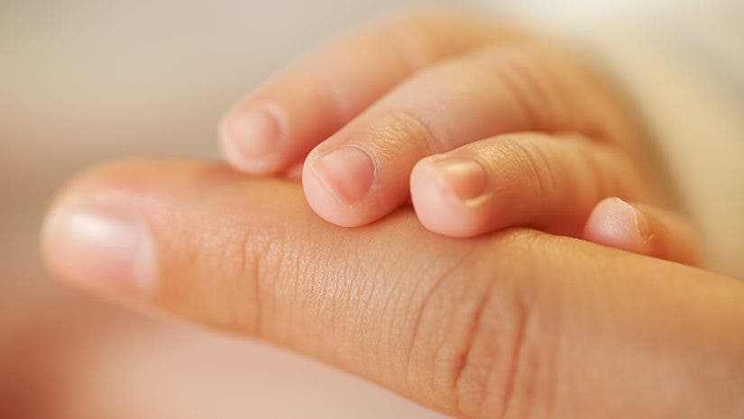 Baby and mother hands together - great idea for Mother's Day, Macro