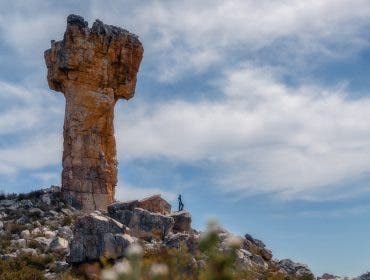 • Muji standing at Maltese Cross caption: Two hours of sweat and determination led me to this breathtaking sight! Just like this hike, life is all about gradual progress.