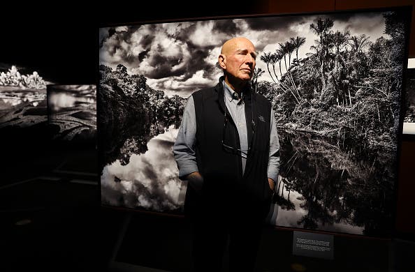 LOS ANGELES, CALIFORNIA - OCTOBER 19: Brazilian documentary photographer Sebastião Salgado stands for a photo at a press preview of his exhibit Amazônia at the California Science Center on October 19, 2022 in Los Angeles, California. The 13,000 square-foot immersive exhibit, designed by his wife Lélia Wanick Salgado, features 200 large-scale photographs and video montages taken over seven years of the Amazon rainforest, remote Indigenous tribes, and the threat deforestation poses to their survival. Salgado says, 'My wish, with all my heart, with all my energy, with all the passion I possess, is that in 50 years' time this exhibition will not resemble a record of a lost world.' The exhibit is making its North American debut on October 21st and is supported by the Annenberg Foundation. (Photo by Mario Tama/Getty Images)