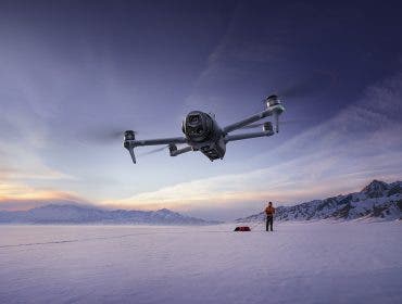 DJI Mavic 4 Pro flying over the snow