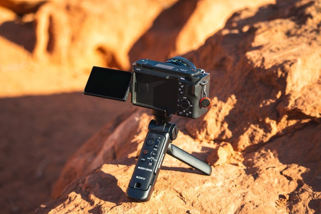 Using the grip as a tripod with the remote stored on the handle