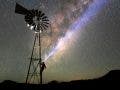 Man on a windmill with Milky Way sky