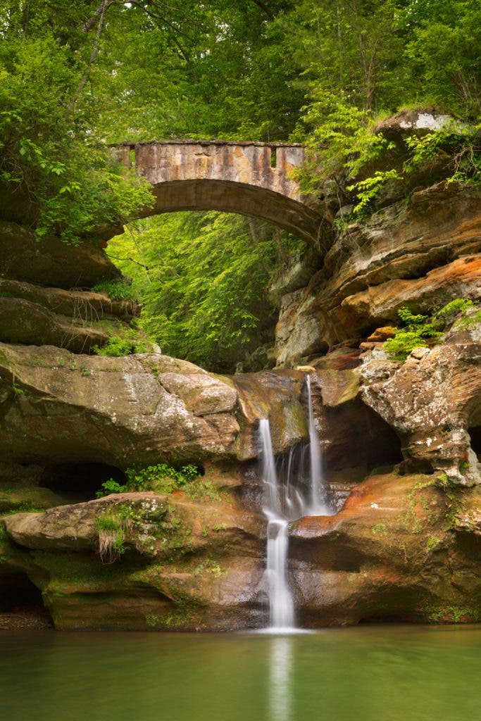 The Upper Falls waterfall and bridge in Hocking Hills State Park, Ohio, USA.