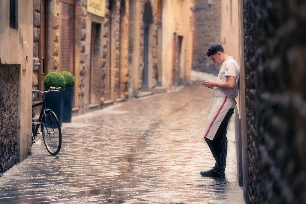 A waiter on a smoke break