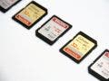 SanDisk SD cards lined up on white background