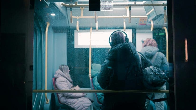 A person wearing a gas mask on a bu