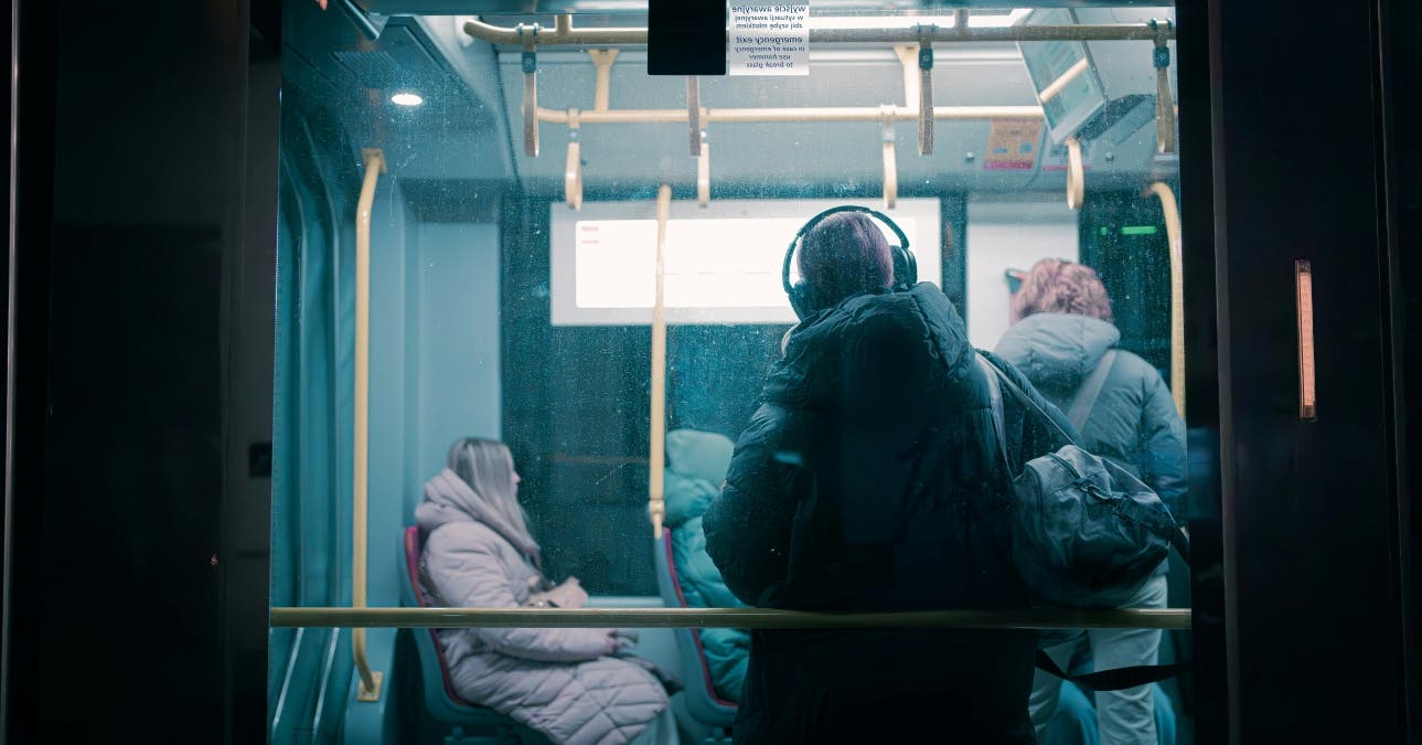 A person wearing a gas mask on a bu