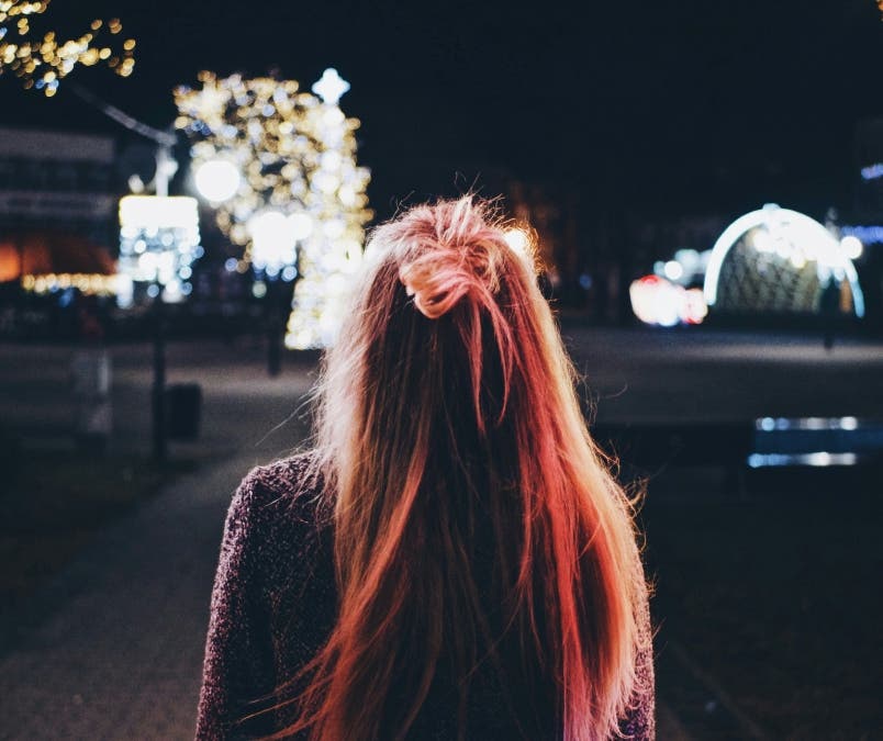 colored hair girl with her hair lit up by light