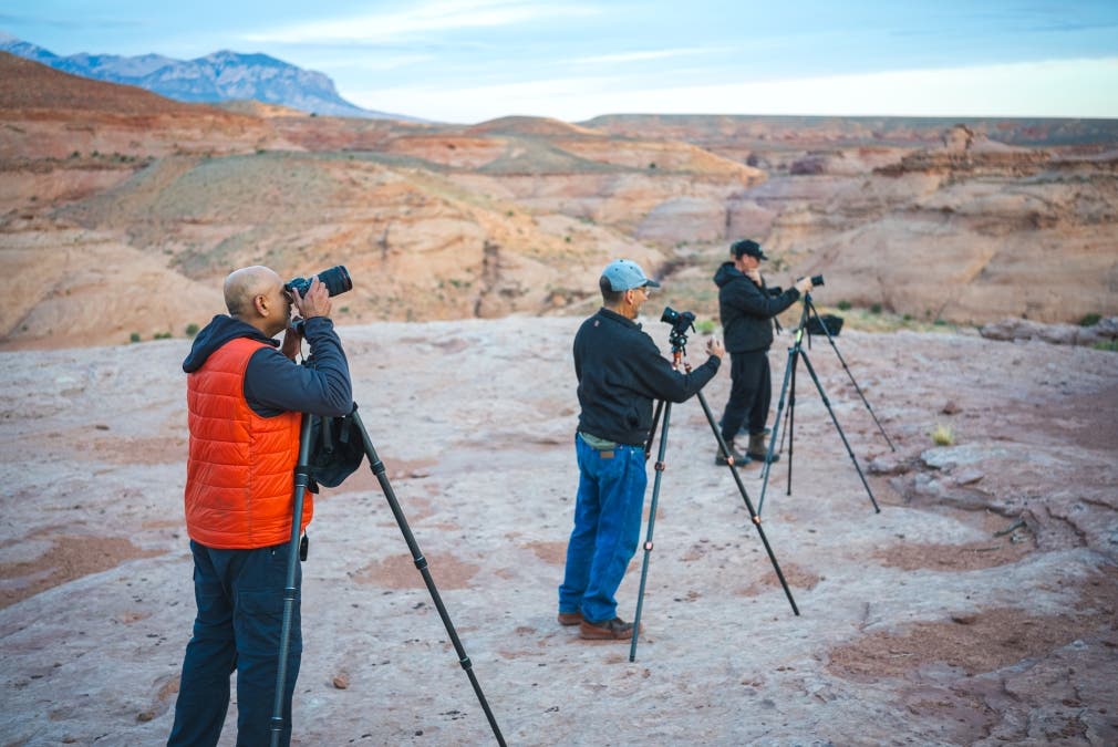 photographers set up their photography equipment for a class