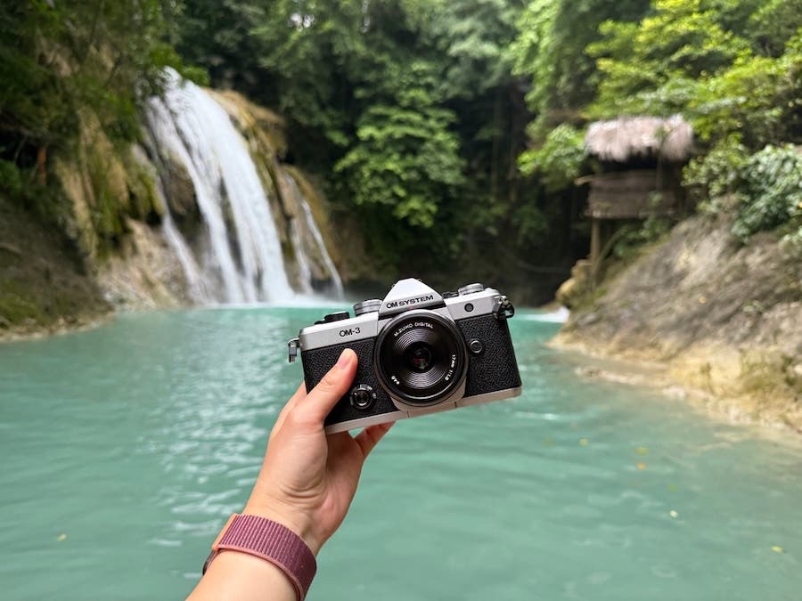 the OM System OM-3 in front of waterfalls