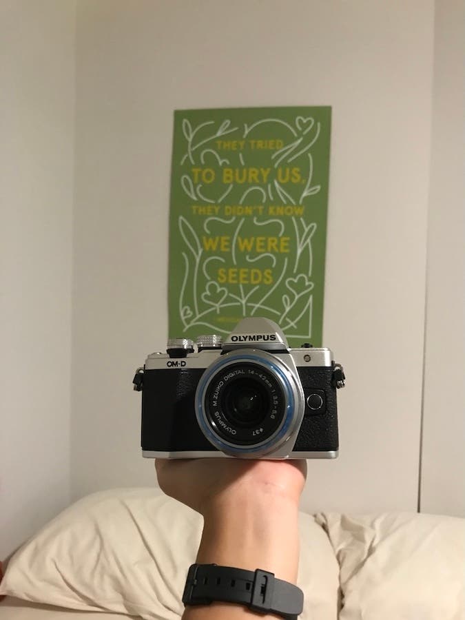 the OM System OM-3 camera in a bedroom