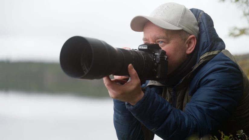 photographer posing with his equipment