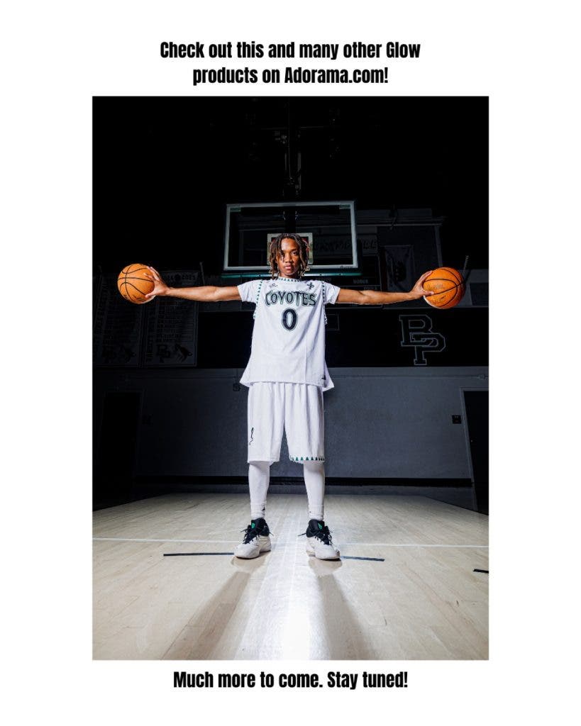 Basketball player posing with two balls