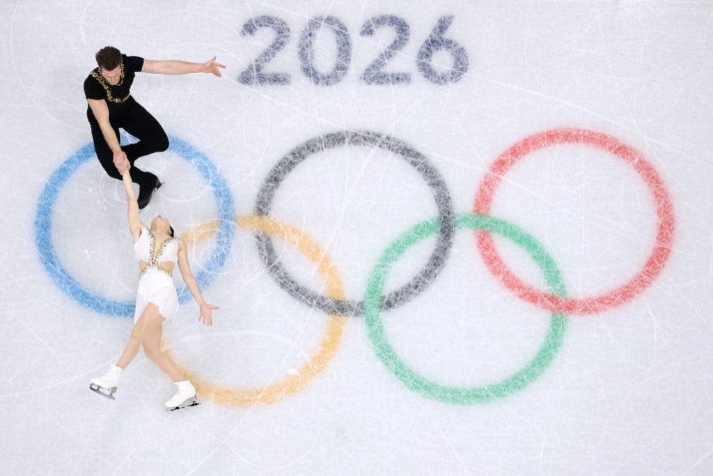 MILAN, ITALY - FEBRUARY 08: (EDITORS NOTE: Image was captured using a robotic camera positioned above the field of play.) Lia Pereira and partner Trennt Michaud of Team Canada compete in Pair Skating - Free Skating Team Event on day two of the Milano Cortina 2026 Winter Olympic games at Milano Ice Skating Arena on February 08, 2026 in Milan, Italy. (Photo by Matthew Stockman/Getty Images)