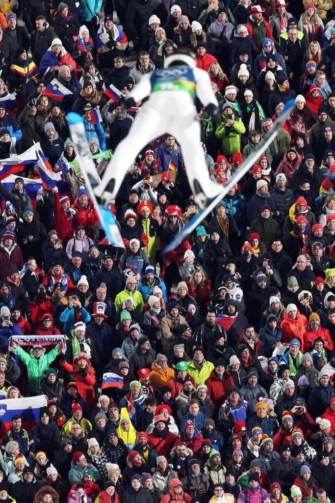 General view as spectators watch Anze Lanisek of Team Slovenia compete in the Mixed Team First Round on day four of the Milano Cortina 2026 Winter Olympic games at Predazzo Ski Jumping Stadium on February 10, 2026, in Val di Fiemme, Italy. Photo by Maddie Meyer/Getty Images