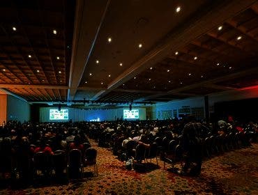 A crowded hall at WPPI 2026 while Annie Leibovitz discusses her new book WOMEN