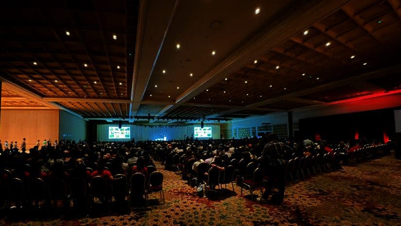 A crowded hall at WPPI 2026 while Annie Leibovitz discusses her new book WOMEN
