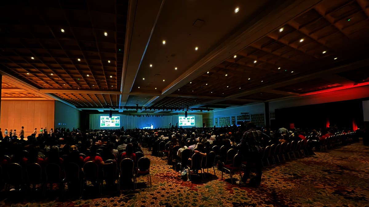 A crowded hall at WPPI 2026 while Annie Leibovitz discusses her new book WOMEN