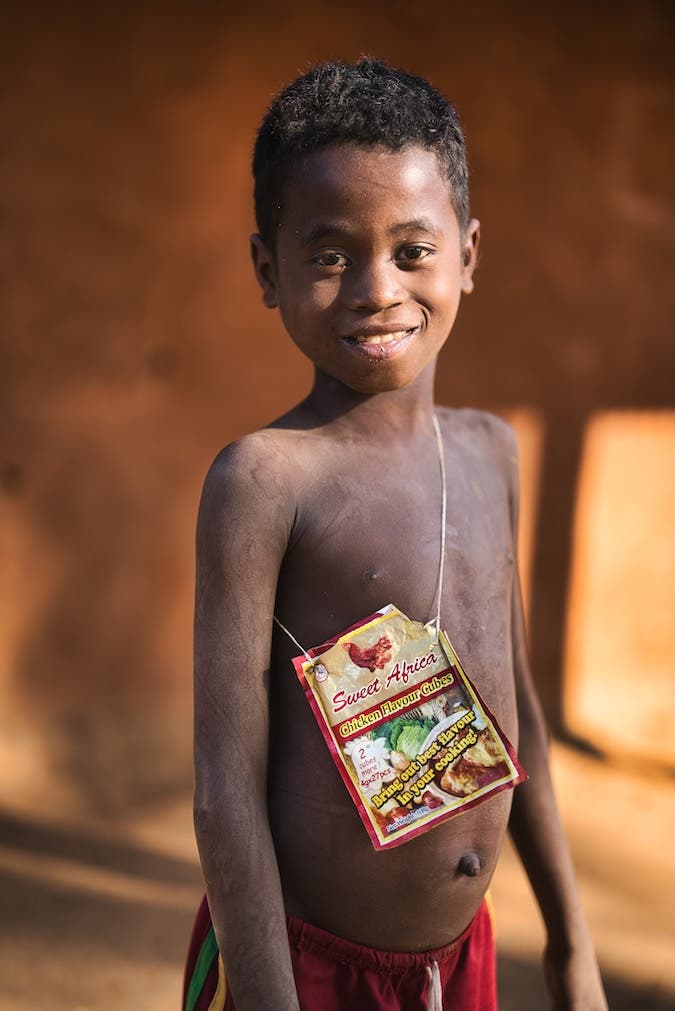 Child with plastic handbag