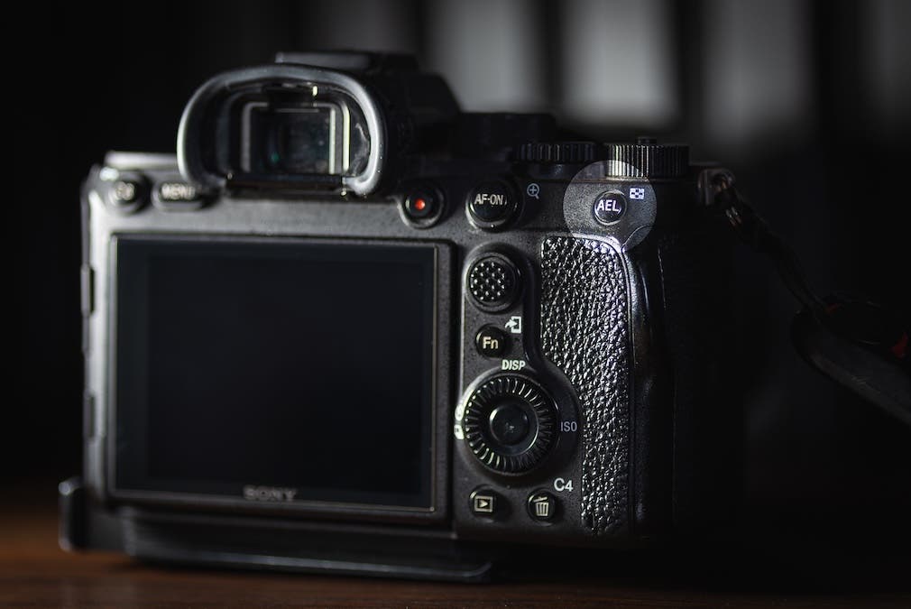 The Auto Exposure Lock is typically located on the right side of the camera, where you can easily access it with your thumb while shooting.