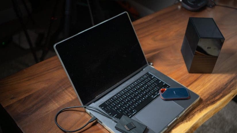 laptop with storage devices on top