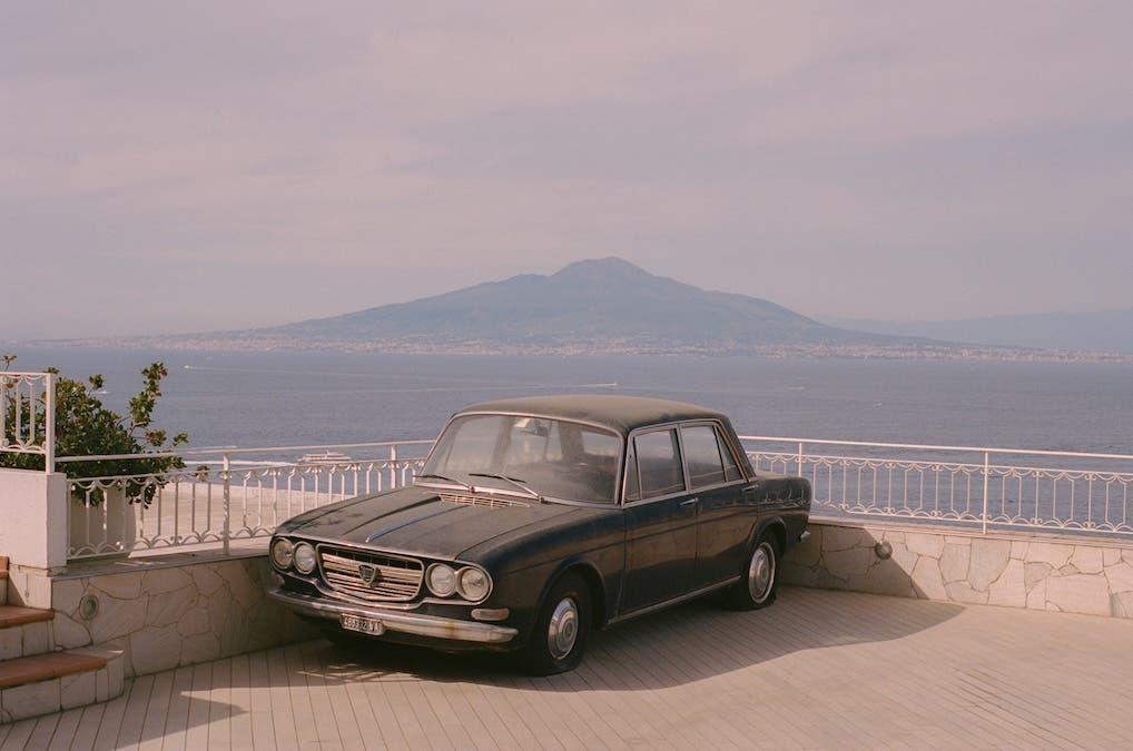 a black Sorento near the beach in midday springtime