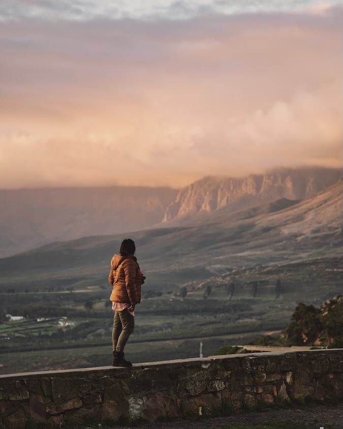 brunette woman staring off into the mountains