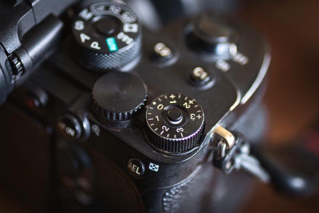 While some cameras have a dedicated exposure compensation button, others have a built-in dial, like this one.