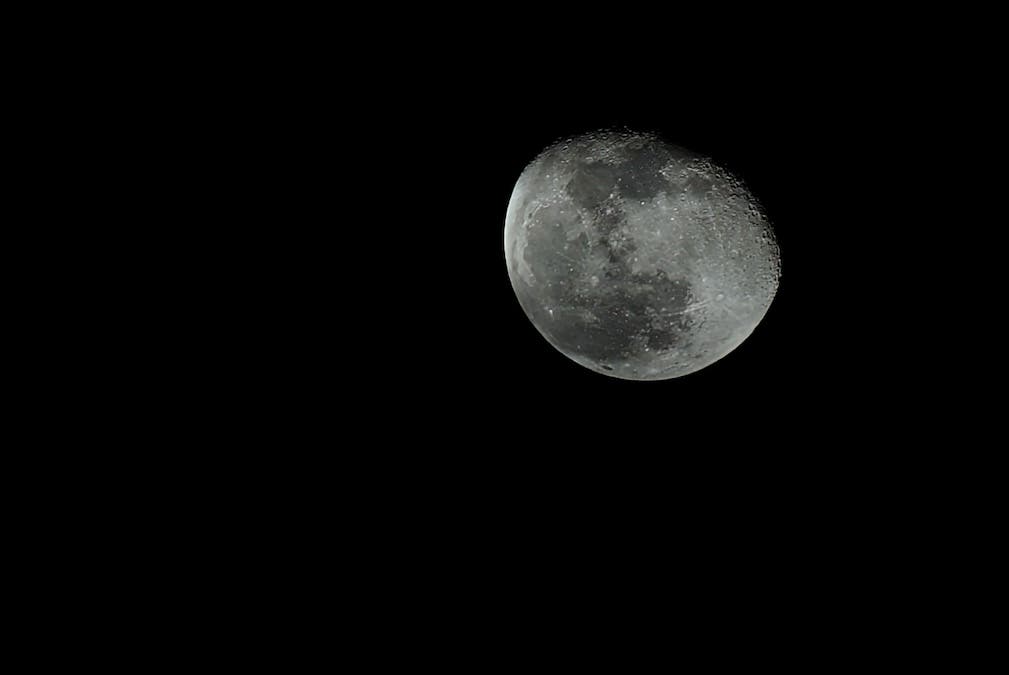 Photograph of a waning gibbous moon in black and white