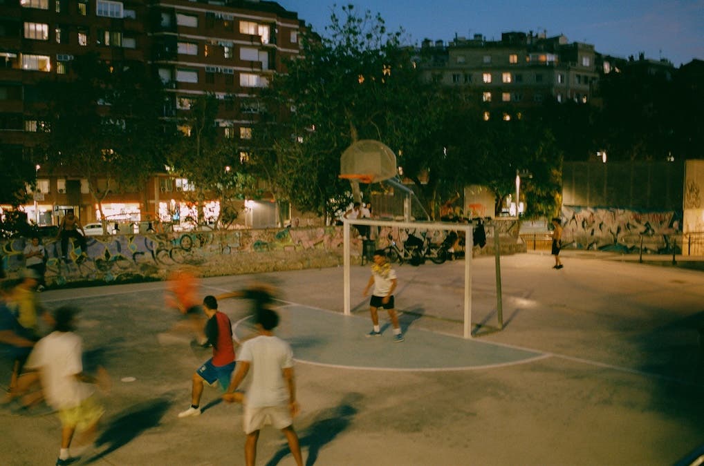 kids playing futsal in a court in Barcelona