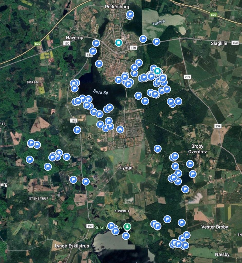 A satellite map centered on Sorø, Denmark, featuring dozens of blue markers indicating specific wildlife observation points. This map, created by Peter Dam, shows the density of nature locations found within a 5-mile radius of his home.