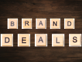 "brand deals" spelled out in wooden characters