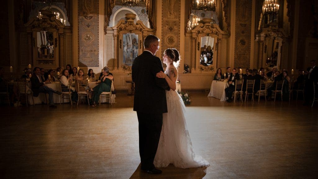 bride and father of bride quietly dance on the floor