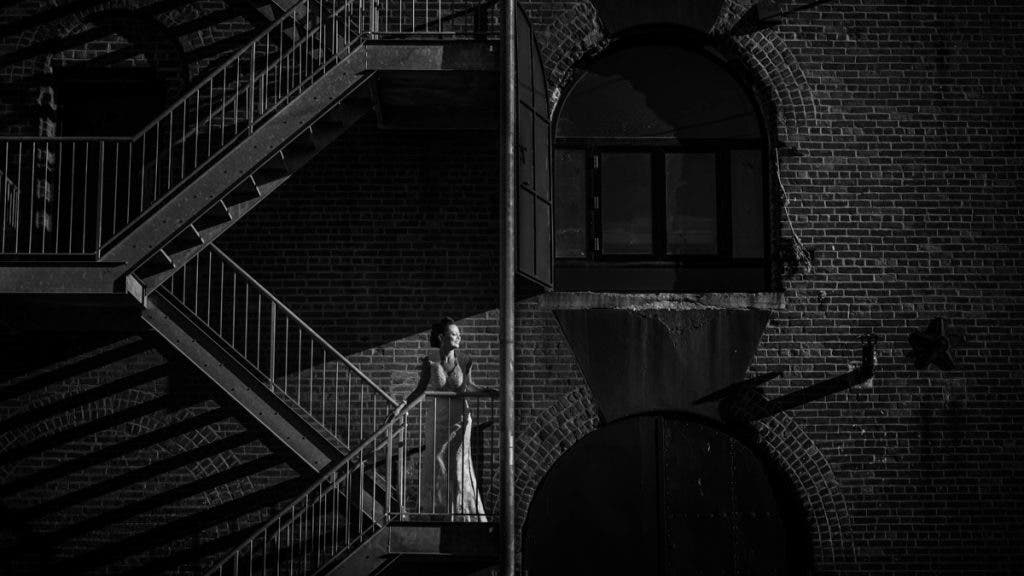 bride poses in black and white wedding photography