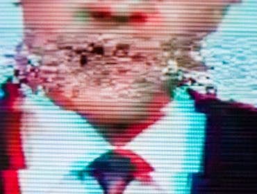 Man in a suit on the screen. Broadcaster. Glitch. Digital errors on the screen.