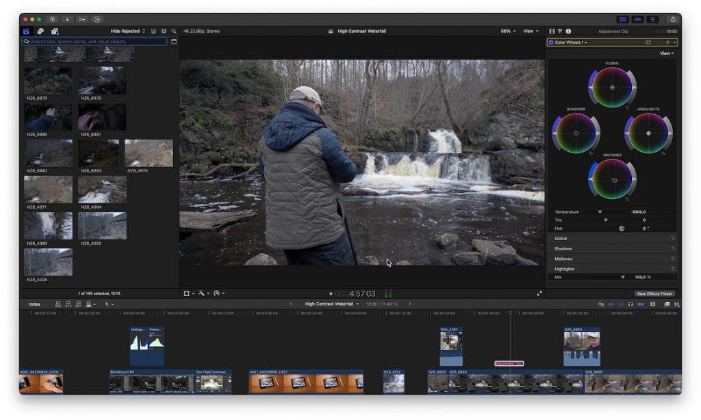 Final Cut Pro interface displaying a video clip of a person facing a waterfall. The Color Inspector panel is active on the right side, showing four color wheels used for adjusting Global, Shadows, Highlights, and Midtones.