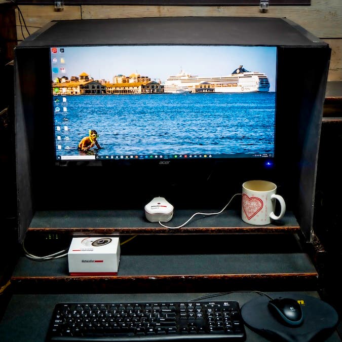 Homemade monitor shield using black Foamcore and duct tape. Cut only the outside skin of the Foamcore with a matt knife and it will stay together and be easier to fold