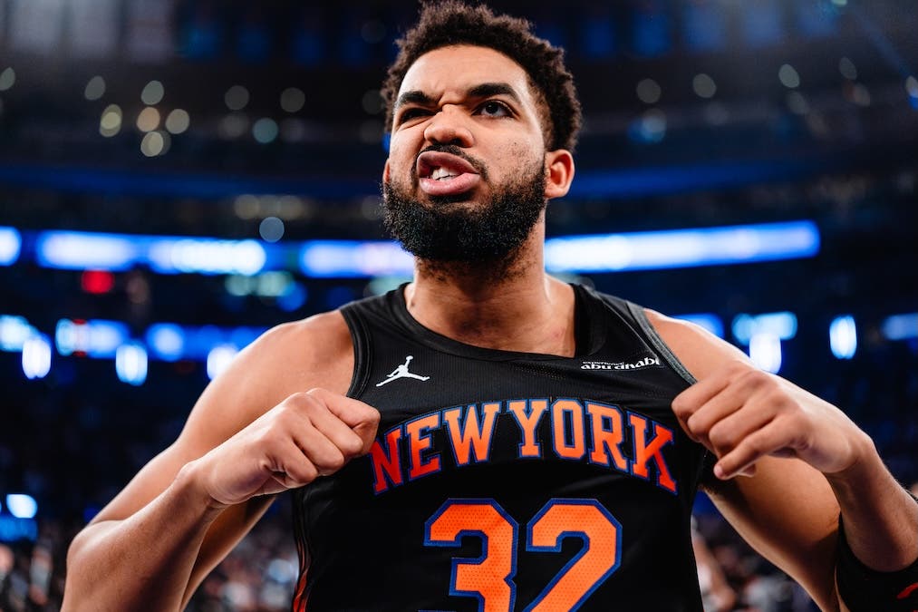 Karl-Anthony Towns flexes his New York Knicks jersey in an emotional reaction during a game against the Philadelphia 76ers