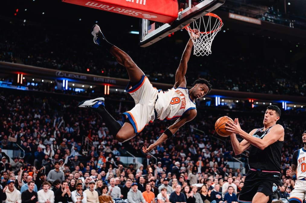 OG Anunoby hangs from the rim after a slam dunk against the Miami Heat