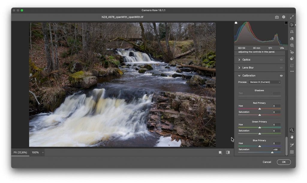 The Adobe Camera Raw interface showing a photo of a small waterfall. On the right, the "Calibration" panel is expanded, showing process version settings and primary color sliders, with the Blue Primary Saturation adjusted to +59