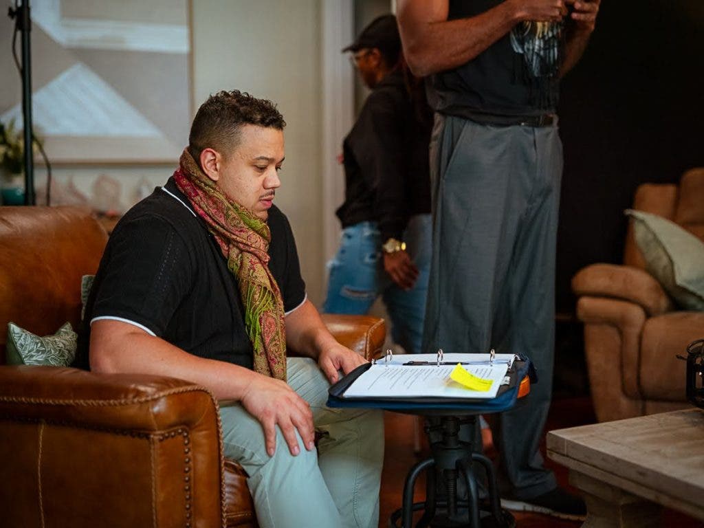 Wearing one of many hats during production, producer Andrès McCorkle takes on script supervisor.