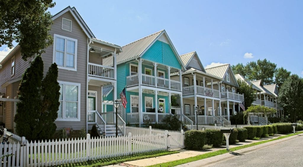 A row of colorful coastal folk style houses shot on a Micro Four Thirds camera