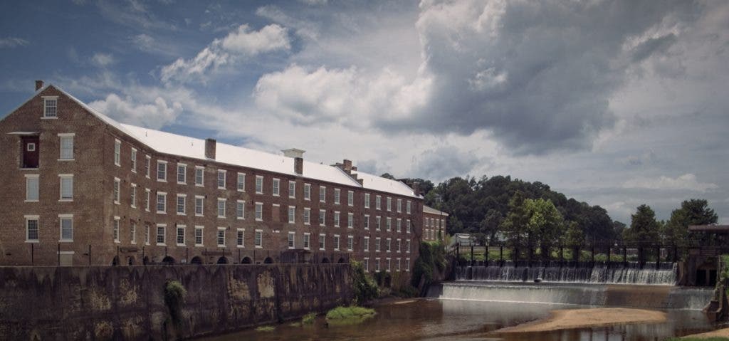 A 1900s brick cotton mill and dam shot on a Micro Four Thirds camera
