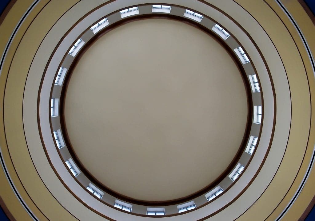 The inside of the dome of a Greek revival building shot on a Micro Four Thirds camera