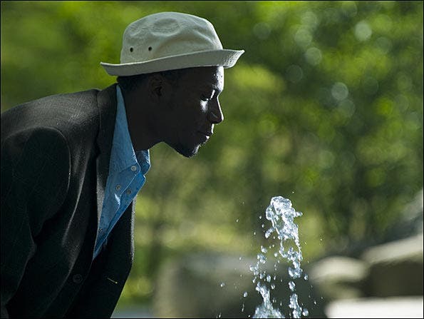 Man drinking water shot