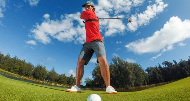 Man playing golf