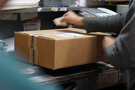 Adorama employee packing orders in the New Jersey warehouse