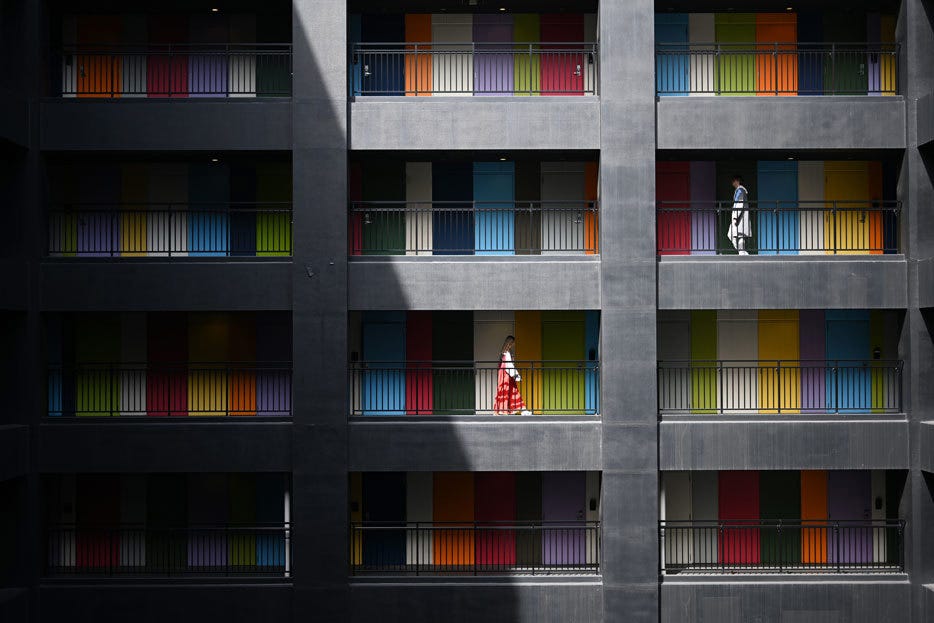 dark gray building with colorful doors and walls shot with NIKKOR Z 50mm f/1.8 S Lens